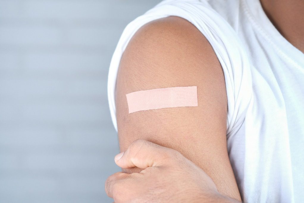 Person with band-aid on upper arm